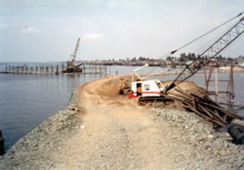   Initial Access Road by quarry spalls for the Reclamation of Area B. The access road includes one of the approaches of the Navotas Cut-Off Channel Bridge